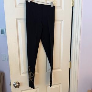 Ralph Lauren black skinny pants with detail and zippers at bottom.